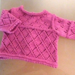 robe rose bébé fille ajourée au tricot